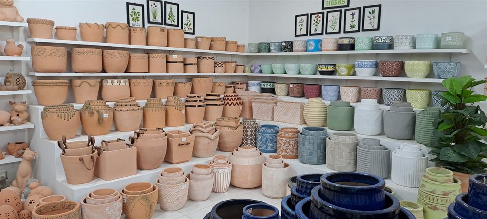 Shelves of terracotta and painted pots
