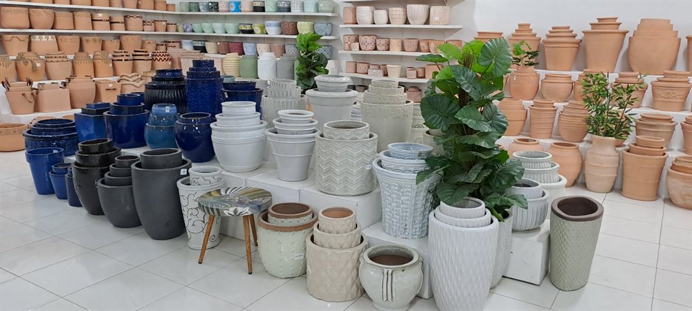 Display of glazed and cement pots