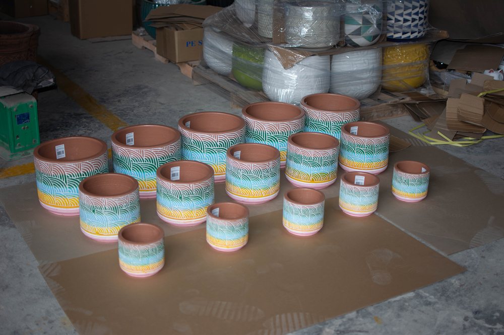 Inspecting painted pots